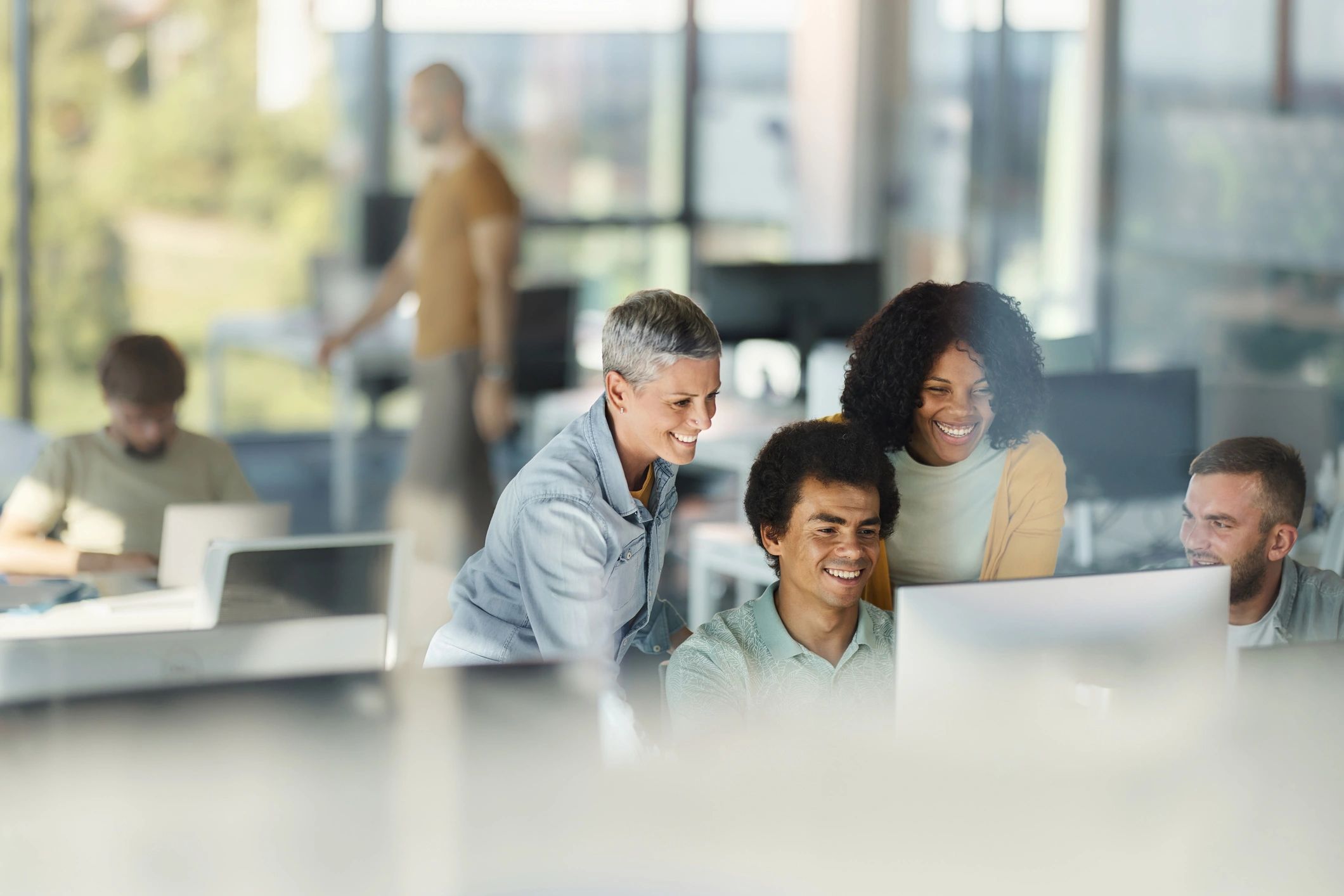 Customer support team collaborating in a modern office