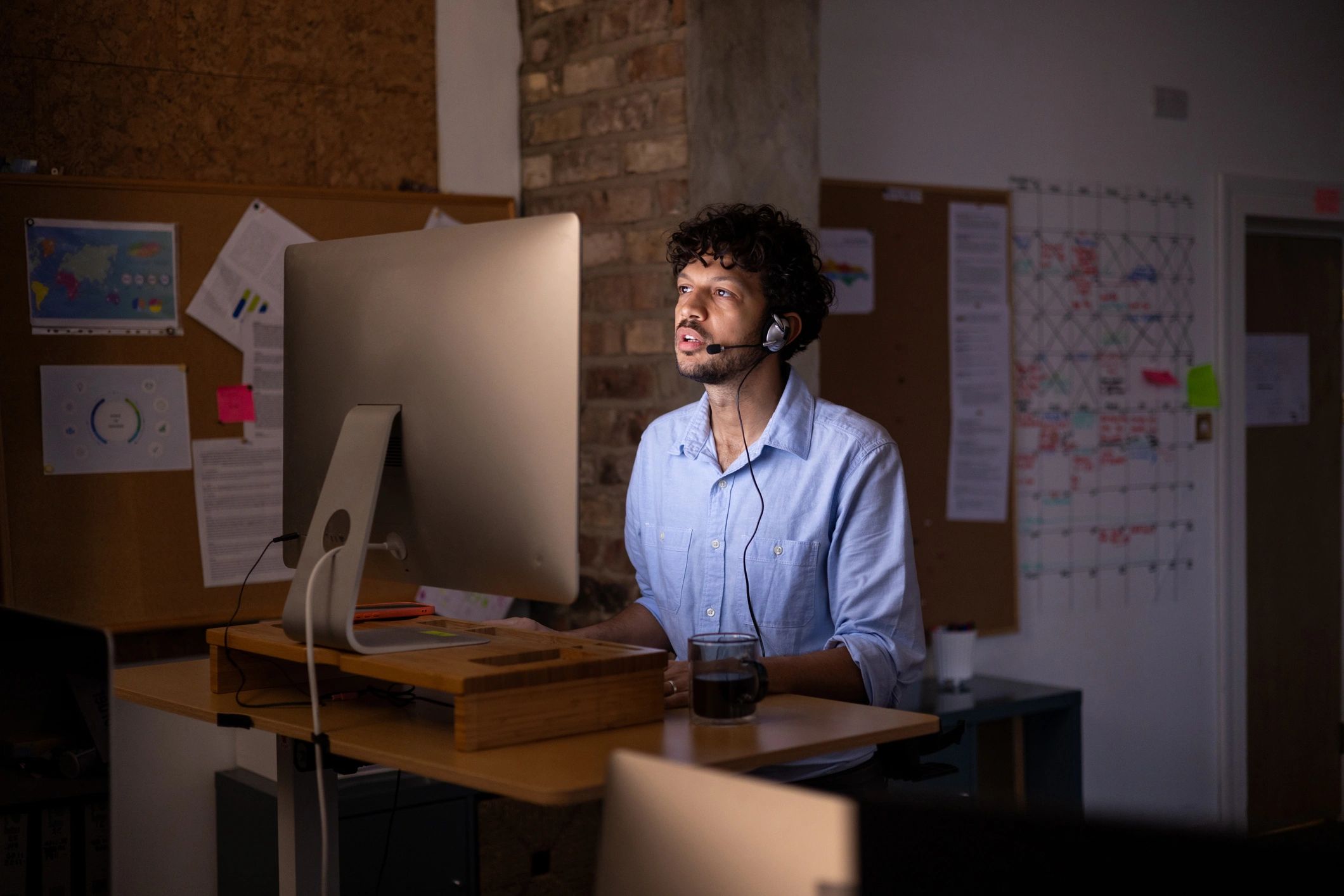 Customer support professional working at a computer